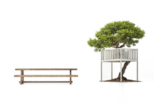 Wooden Bench and a Treehouse with a White Railing photo