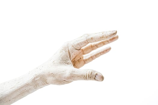 Closeup of a Wrinkled Hand Reaching Out photo