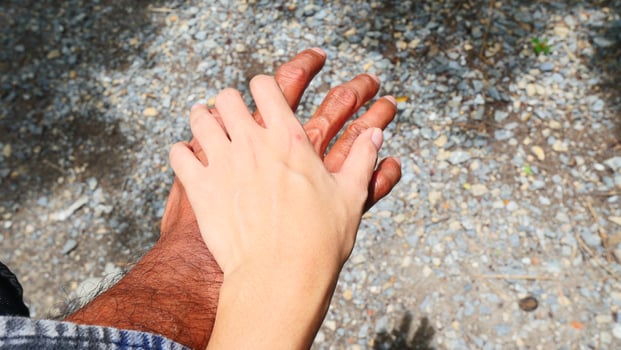 The hands of women and men of different skin colors and status were held together photo