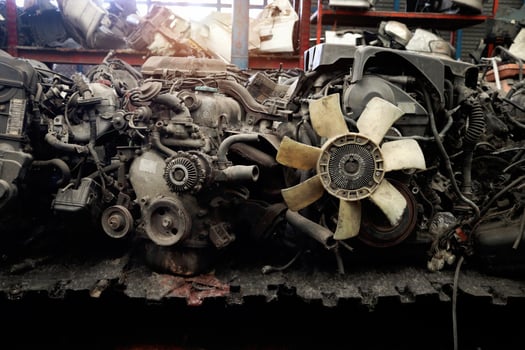 Auto parts and secondhand engine components in auto spare parts store. Spare parts of vehicle in warehouse. photo