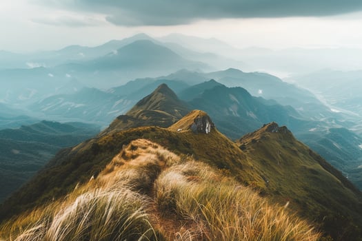 A view of the mountains from the top of a mountain photo
