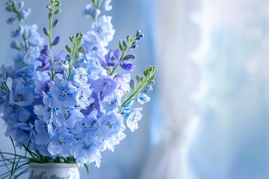 Blue flowers in a vase on a table background photo