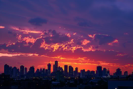 A City Skyline with a Sunset in the Background and a Scenic Background photo