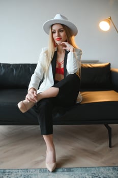 Portrait of a beautiful and sexy woman at home. photo