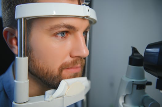 Ophthalmology concept. Male patient under eye vision examination in eyesight ophthalmological correction clinic photo