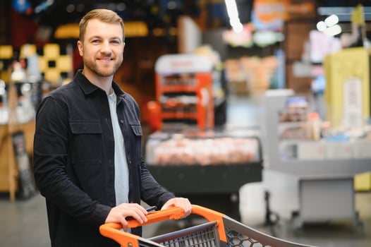 man in supermarket, grocery store customer photo