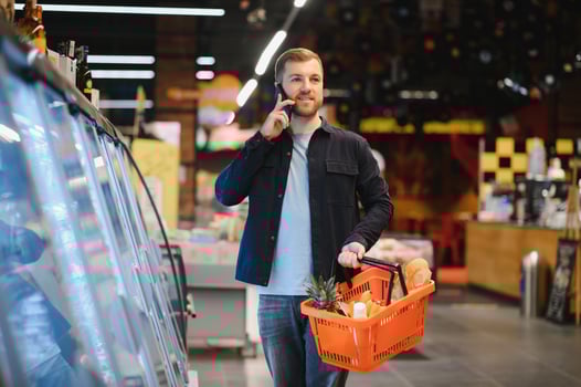 man in supermarket, grocery store customer photo