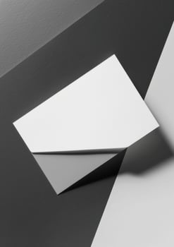 top view of white business card on grey background for mockup photo