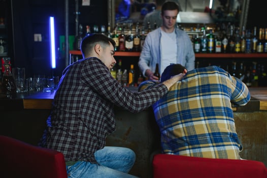 Young drunk man in bar photo
