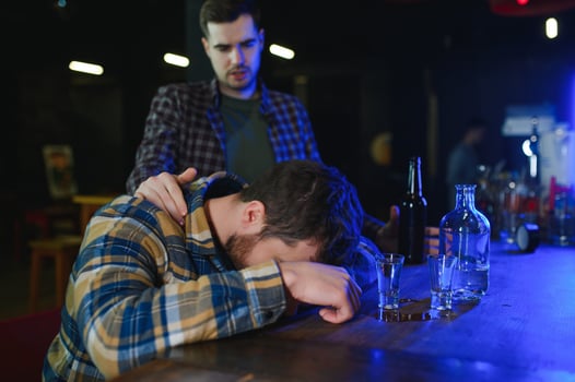 Sad man sitting at bar counter, alcohol addiction photo
