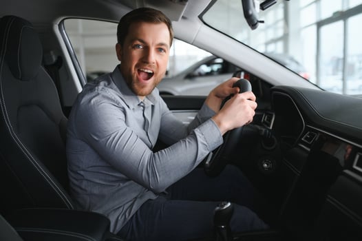 Man sits in his lovely car. photo