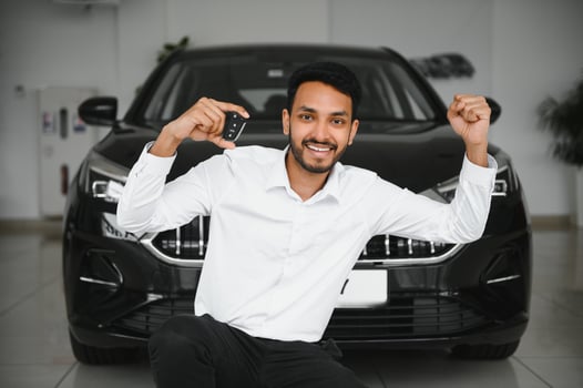 Closeup portrait happy, smiling, young man, buyer showing keys of his new car photo