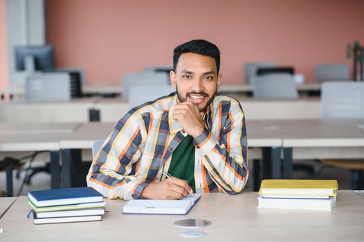 Happy indian male student at the university photo