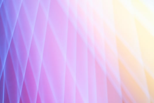 A backdrop of geometric shipes with a golden glow photo