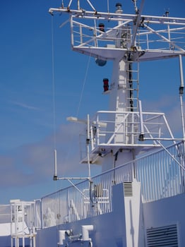 Radar antennas on board of a cruise ferry ship. Navigation system of the liner. Elements of radio location equipment in the ultrasonic wave range. photo