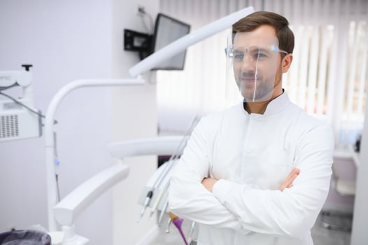 Young male dentist in clinic photo