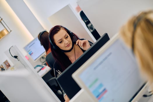 Friendly Call Center Agent Answering Incoming Calls with Headset Providing Remote Customer Service. photo