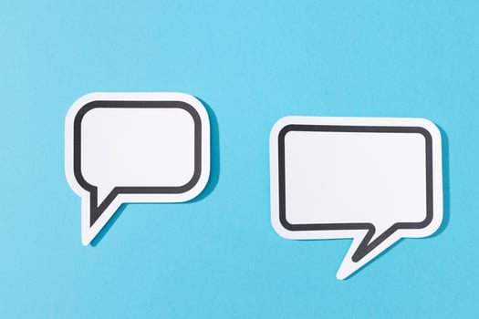 Two Blank Speech Bubble isolated on blue background. Mock up template photo