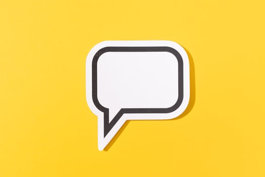 Blank Speech Bubble isolated on yellow background. Mock up template photo