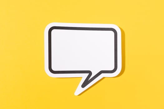 Blank Speech Bubble isolated on yellow background. Mock up template photo