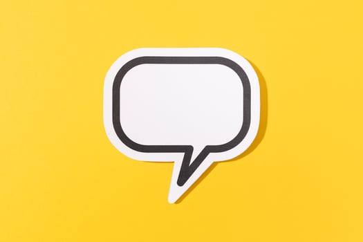 Blank Speech Bubble isolated on yellow background. Mock up template photo
