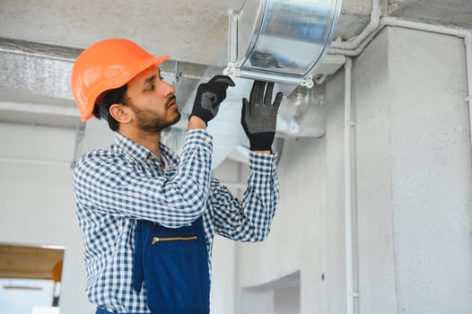 Ventilation cleaning. Specialist at work. Repair ventilation system HVAC. Industrial background photo