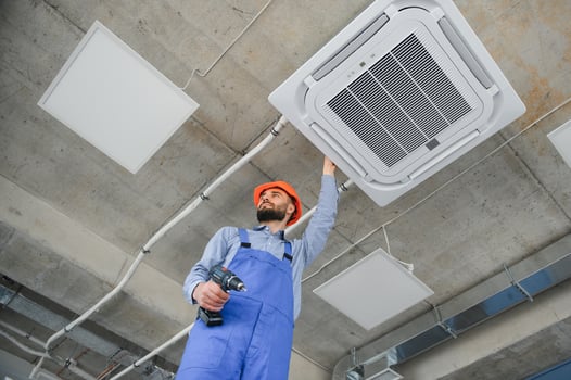technician service checking and repairing air conditioner indoors photo