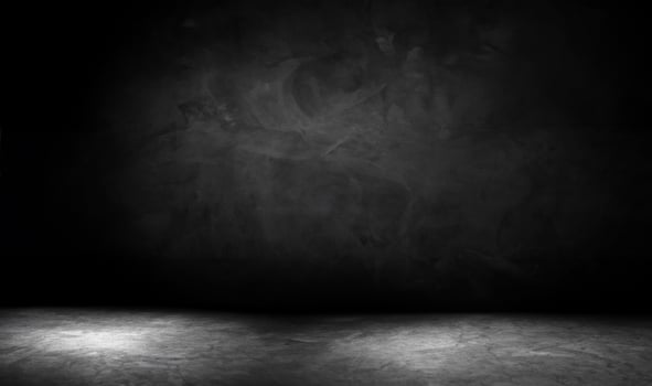 Empty Brown Wooden Table with Blurred Black Brick Wall Background for Product Display photo