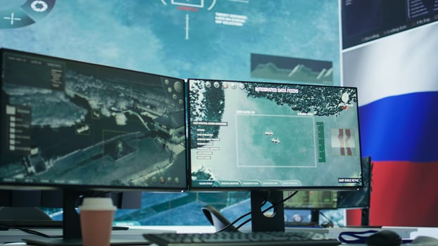 Empty russian federation military command post managing cyber warfare propaganda, scaring the population into submission. Army headquarters base of operations with russian flag. Camera B. photo