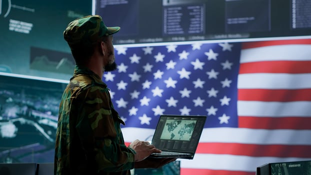 US soldiers operating in a high tech cybersecurity command post, managing state secrets and classified information. Protecting servers against digital threats and cyber warfare. Camera A. photo
