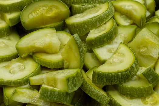 Fresh green zucchini background. Close-up photo