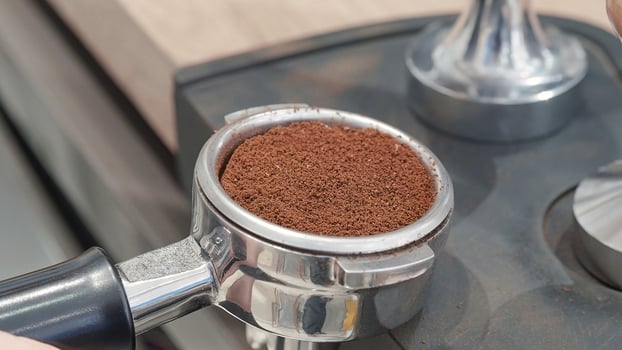 Fresh Ground Coffee in Portafilter Ready for Tamping. photo