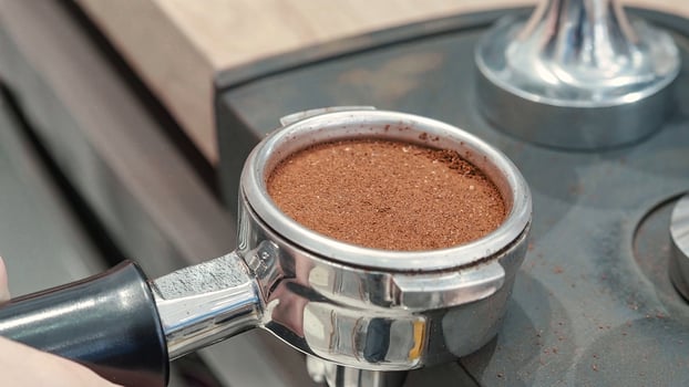 Perfectly Tamped Coffee in Portafilter. photo