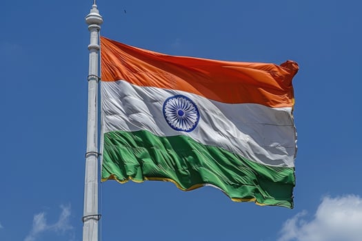 Indian flag waving on blue sky background photo