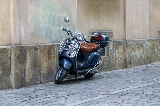 black classic motorcycle near a stone wall photo