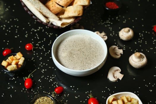 Creamy Mushroom Soup With Toasted Bread and Cherry Tomatoes photo