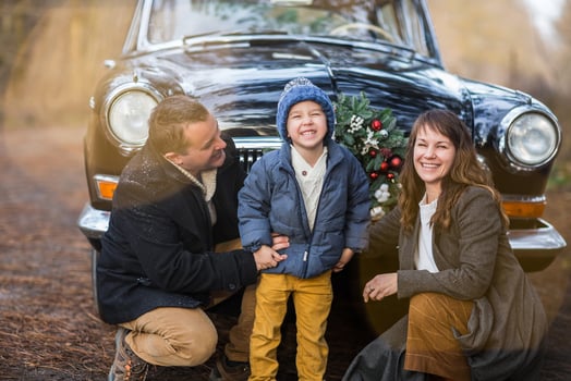 Stylish couple with kid in park photo