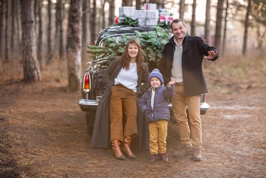 Stylish couple with kid in park photo