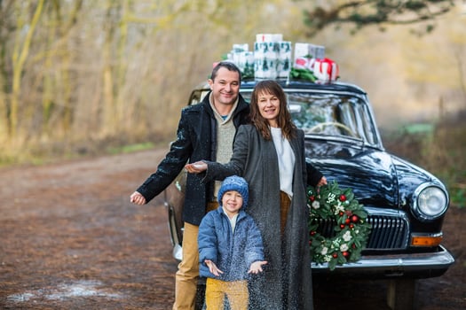 Stylish couple with son in park. Holiday concept photo