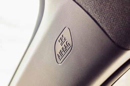 Safety side curtain airbag sign in new modern car photo