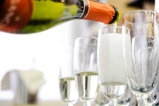 Pouring Sparkling Wine into Flute Glasses photo