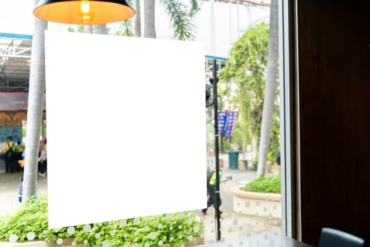 Blank poster billboard template. Blank Sign Label and Placard attached to the window glass. photo