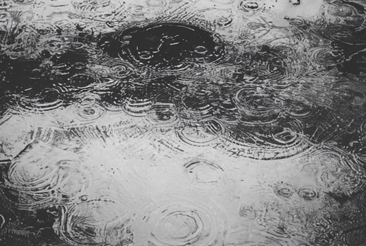 Raindrop on Wet Street Surface photo