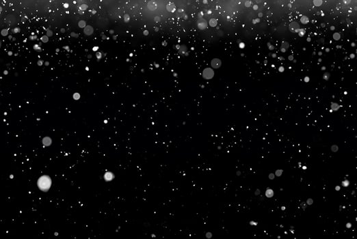 White Snow Bokeh on Black Background - Snowfall Design Element photo