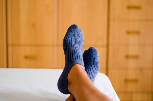 feet in blue socks, Soft and breathable. photo