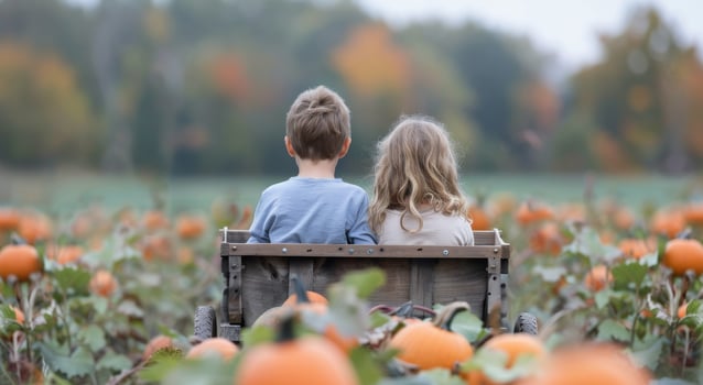 Children Riding Wagon Through Pumpkin Patch photo