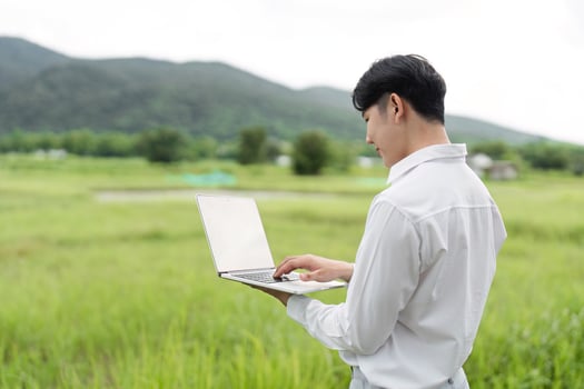 Agricultural Researcher Using Technology in Field to Enhance Crop Production and Monitor Agricultural Data photo