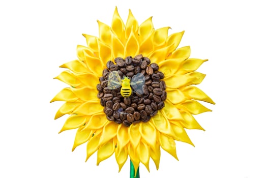 Stylized sunflower made of fabric and coffee. Handmade flower crafts on a white background. Sunny baby flower concept. Symbol of summer and sun photo