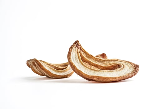Dried apple slices on white background photo