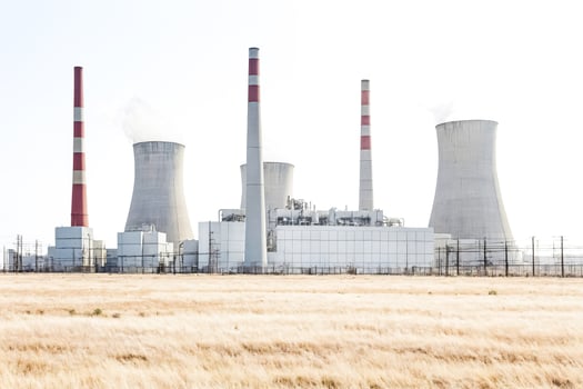 Power Plant with Cooling Towers and Red and White Striped Chimneys photo